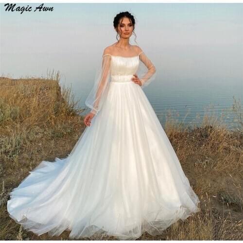 Magic Awn 2021 Beach Wedding Dresses Illusion Long Sleeves Beaded Shiny Boho Wedding Party Dress A-Line Robe De Mariage