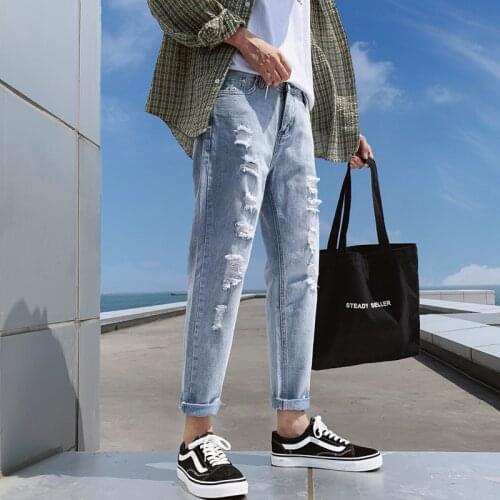 Autumn and summer new style ripped jeans mens trend Korean version of slim young students' feet pants 9 points pants