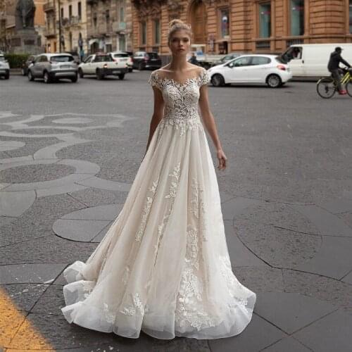 New Arrival Scoop Cap Sleeve Beads Appliques Lace Button See Through Back A-Line Wedding Dress 2021 Vestido De Noiva Bridal Gown