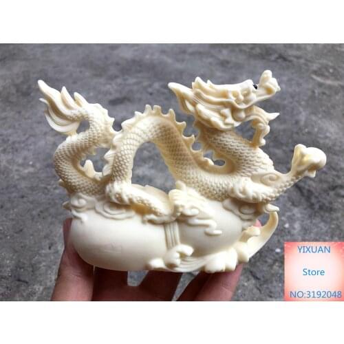 Adorno de dragón de fruta de marfil, talla adorno calado, levantamiento de dragón en la edad de oro