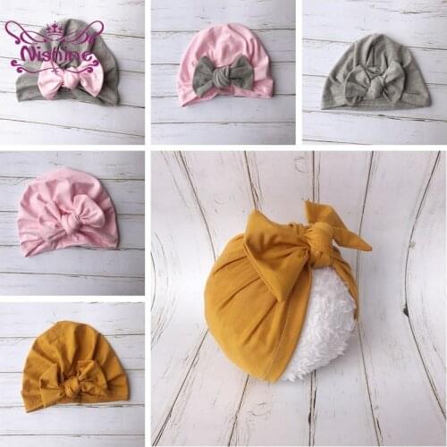 Nishine Newborn Fabric Solid Color Stitching Indian Hat Infant Bow Knotted Skull Beanies Hat Baby Gifts outdoor decoration