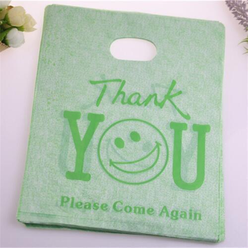 New Design Wholesale 100pcs/lot 20*25cm Green Plastic Shopping Bags With Smile Face Thank You Gift Bags Packaging