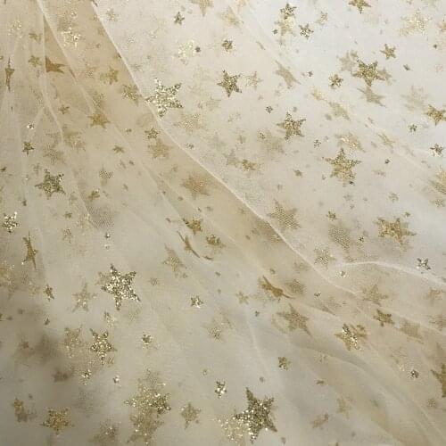 A rice Beige champagne gold five pointed star gauze lace cloth bronzing Mantianxing dress fabric