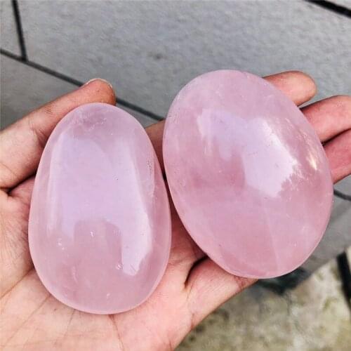 Beautiful natural rose crystal hands play natural crystal hand polishing as gifts of natural crystal reiki healing