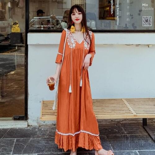 Summer new Korean version ins Bohemia travel vacation beach dress retro ethnic embroidery V-neck fringed petal sleeve long dress