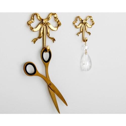 Wall hook Coat hook Brass three-dimensional Handmade crafts Creative bow Send a Gift Home wall decoration Household products