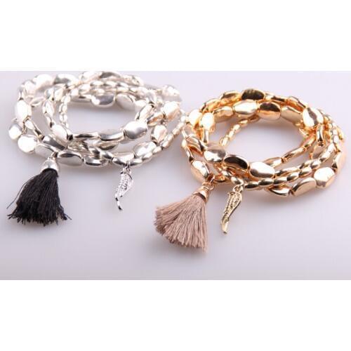 Free shipping Fashion Women 4 stripe Alloy beads with Tassel and Wing charm Stretched Bracelets