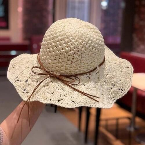 Handmade foldable straw hats ladies travel beach adjustable hollow cap bow big brim sun caps fashion joker fisherman hat