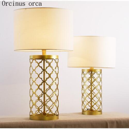 American modern simple golden table lamp living room bedside lamp post modern creative personality LED hollow iron desk lamp