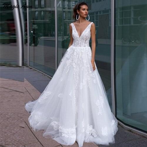 Magic Awn Elegant Lace Tulle Wedding Dresses Beach Appliques V-Neck Backless Illusion Country A-Line Boho Princess Wedding Gown