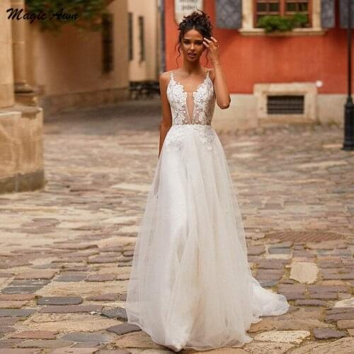 Magic Awn New Bohemian Wedding Dresses 2021 Lace Appliques Backless Spaghetti Straps Illusion Country Wedding Party Gowns Robe