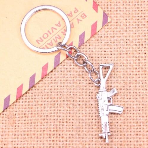 20pcs Fashion Keychain 45x13mm machine gun assault rifle Pendants DIY Men Jewelry Car Key Chain Ring Holder Souvenir For Gift