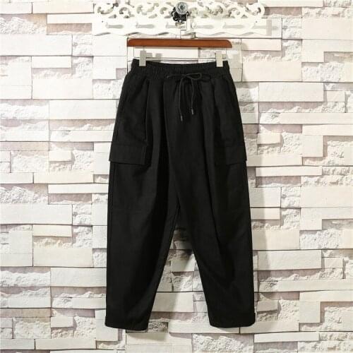Autumn and winter mens new pure color fastens belt loose waist fashion casual pants trend loose go with straight leg pants