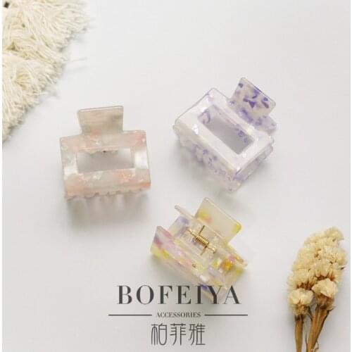 South Koreas Dongdaemun ins wind fresh texture acrylic temperament hollow acetic acid trumpet hair grab back head grab clip