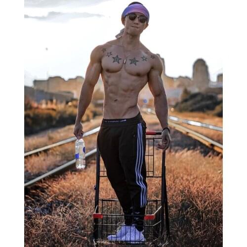 Muscle Brothers' New Jogging Strap Sports Pants For Men With Three Bars For Teenagers in a Trendy Solid Color Casual Pants