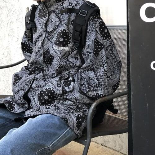 Harajuku fashion brand for men and women wear black baseball uniform on both sides. Couples loose coach jacket cashew flower