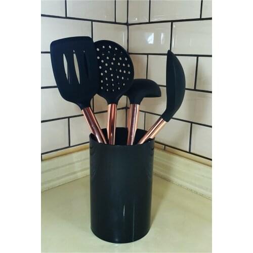 Set of 4 Black Anti-Scratch Silicone Spoon, Ladle, Colander, Spatula with Rose Gold Metal Handle on the Countertop Cookware