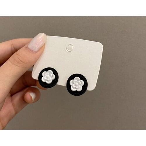 Small simple camellia earrings 2021 new trendy small fragrance style retro port wind stud temperament