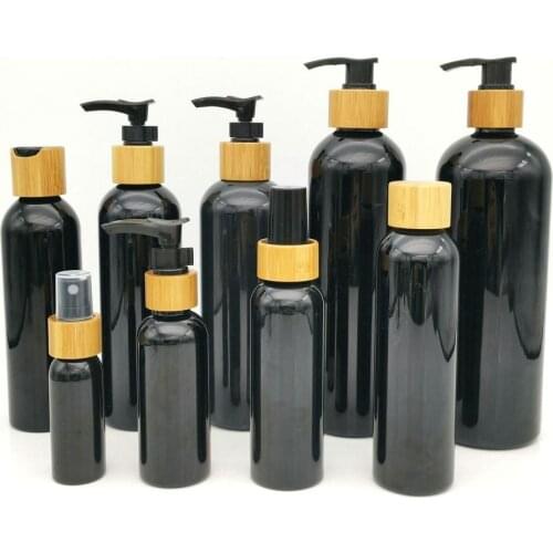Custom logo 200ml Black PET plastic lotion bottle bamboo lid head shampoo/body wash bamboo pump lid Treatment Pump Serum Bottle