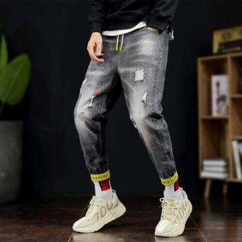 2021 New plus-size jeans European and american fashion handsome baggy jeans plus-size popular logo broken hole hip-hop jeans