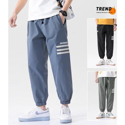 2021 New Mens Casual Sweatpants Solid High Street Trousers Men Joggers Loose Brand High Quality Mens Pants Elastic Waist 4XL