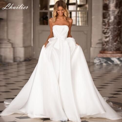 Lhuilier A-line Strapless Satin Wedding Dresses 2020 Sleeveless Pleated Floor Length Bridal Dress Court Train with Bow Belt