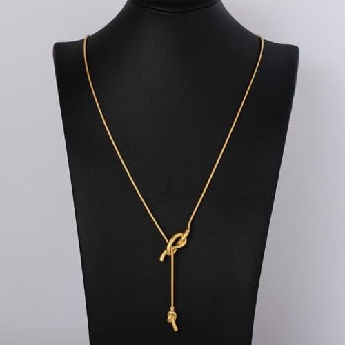 Matte gold minimalist sailor knot y glyph with sweater t-shirt necklace