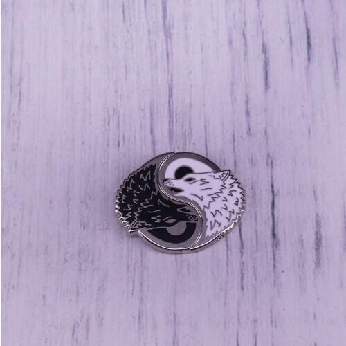 Yin yang black and white wolves enamel pin