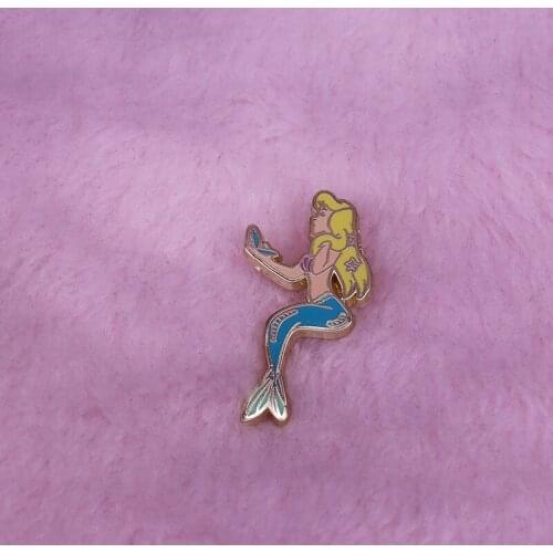 Charming mermaid brooch Young blonde sea-maid looks in mirror