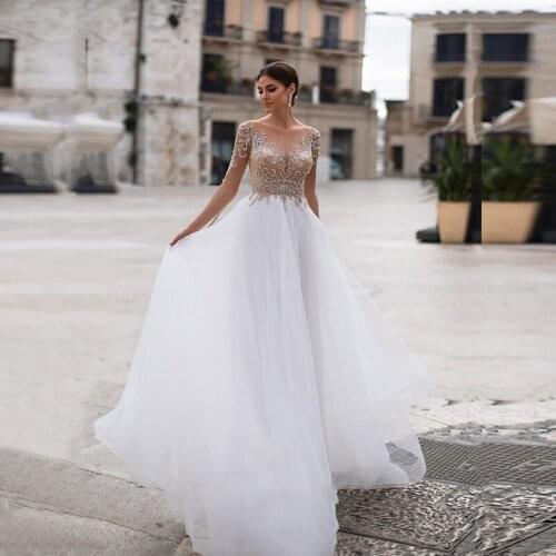 2021 On Sale Charming Long Sleeves Bridal Wedding Dresses Illusion Jewel Neck Beaded Wedding Gowns for Bride Sheer Buttons Back