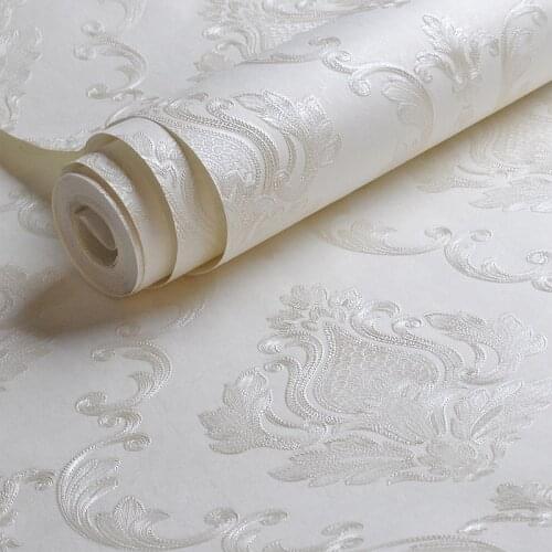 Beibehang milky white embossed damask wallpaper bedroom living room background floral pattern 3D texture wallpaper decoration