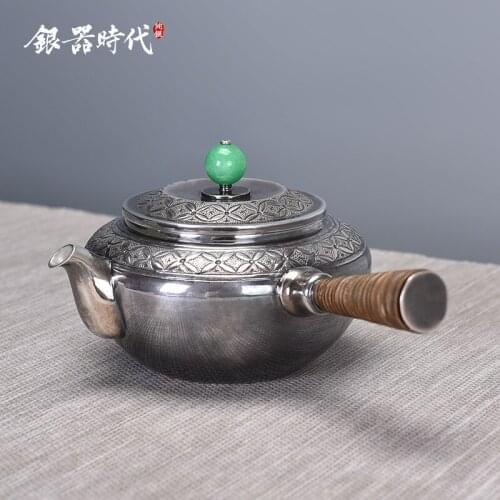 Silver 999 teapot manual carve patterns or designs on woodwork side to filter the silver tea set kunfu tea kettle