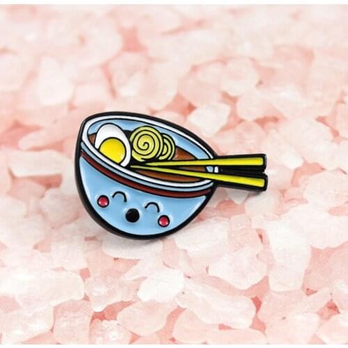 Delicious food in a blue smiley bowl with an egg brooch makes people full of appetite for food friends accessories