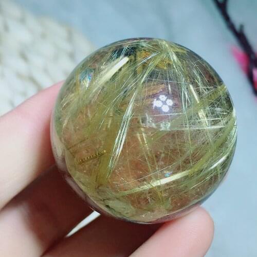 Golden rutilated sphere