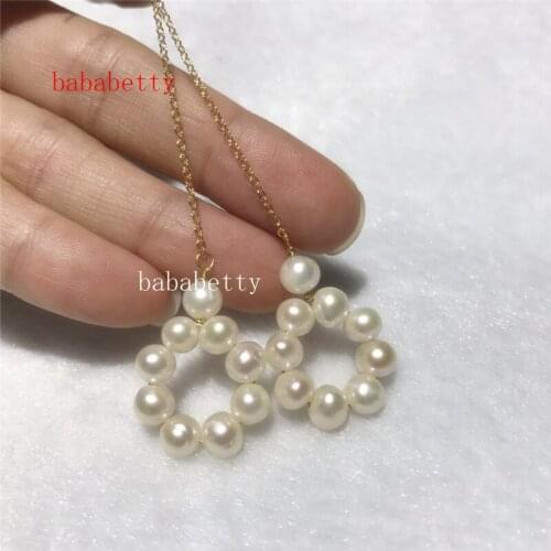 Fashion new elegant natural freshwater pearl handmade 5-6MM white light purple pearl swing earrings