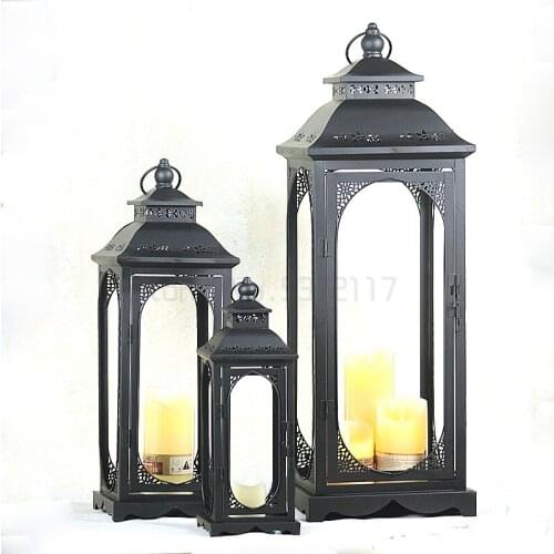 Factory Direct European Retro Hollow Storm Lantern Crafts Decorations and Ornaments Iron Glass Metal Candlestick Storm Lantern