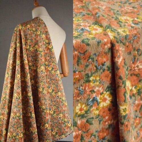 High quality corduroy fabric Orange watercolor flower print tissu Autumn winter dress pants cheongsam material