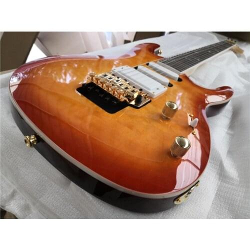 Free shipping custom 6 string cherry sunburst guitar,HH pickups,tremolo bridge,quilted maple veneer,flower inlay,gold buttons