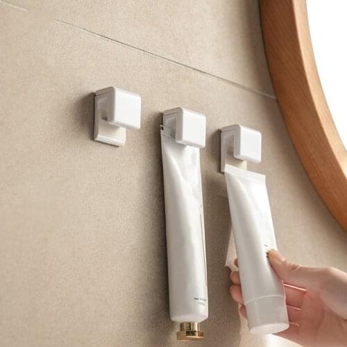 Self Adhesive Toothpaste Rack Hanging Holder Facial Cleanser Clip Wall Mount Stand Organizer Bathroom Accessories Storage Kit