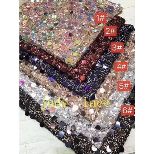 6-colour round sequins embroidered sequin fabric of African style are used in the wedding dress fashion stage
