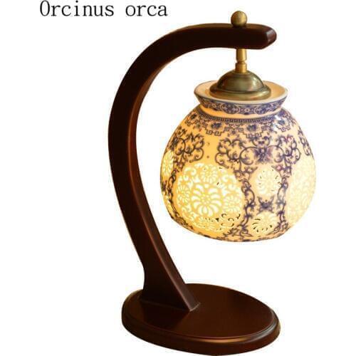 New Chinese classical hollow led ceramic table lamp bedroom bedside lamp American Pastoral creative solid wood desk lamp