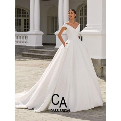 2021 wedding dresses wide v neck cap sleeves ball gown bridal dress satin top organza bottom Cathedral Train with pockets