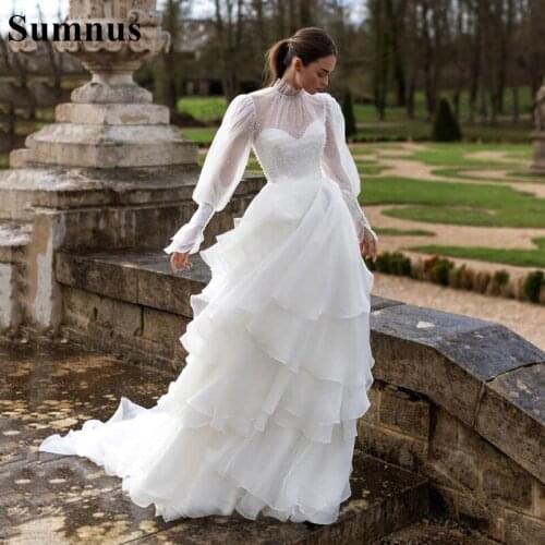 Sumnus Ball Gown Wedding Dress 2021 White High Neck Buttons Ruffles Long Sleeves Tiered Bridal Dress Princess Wedding Gowns