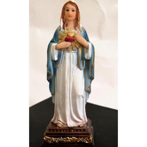 Angel figure the virgin touched the sacred heart statue of Mary placed prayer cart with Catholic holy object of Jesus Christ