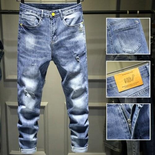 Spring jeans men slim body small feet Korean version of the trend of simple men leisure hole popular logo elastic nine points pa