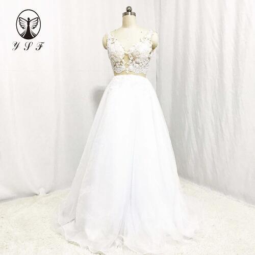 Sexy Bride Dresses V Neck Appliqued Beaded Pearls Sleeveless Illusion Back Floor Length Beach Wedding Gown