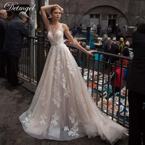 Detmgel Sexy V-Neck Backless A-line Wedding Dresses 2021 Luxury Beaded Appliques Satin Court Train Princess Wedding Gown