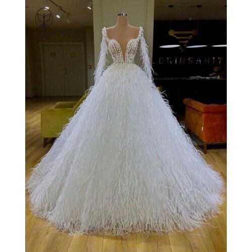 Modest Wedding Dresses Deep V Neck Beaded Pearls Long Sleeve Feather Ball Gown Floor Length Bridal Gown