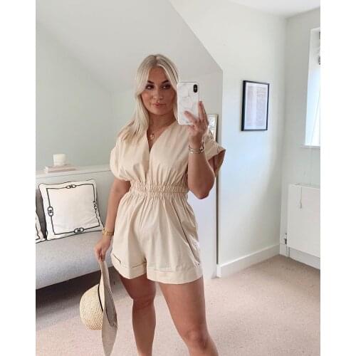 European and American womens street style simple retro loose pleated V-neck jumpsuit elastic waist casual western style shorts