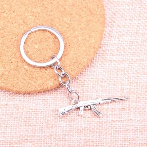 20pcs 44*15mm machine gun assault rifle ak-47 Pendants DIY Men Car Key Chain Ring Holder Keyring Souvenir Jewelry Gift